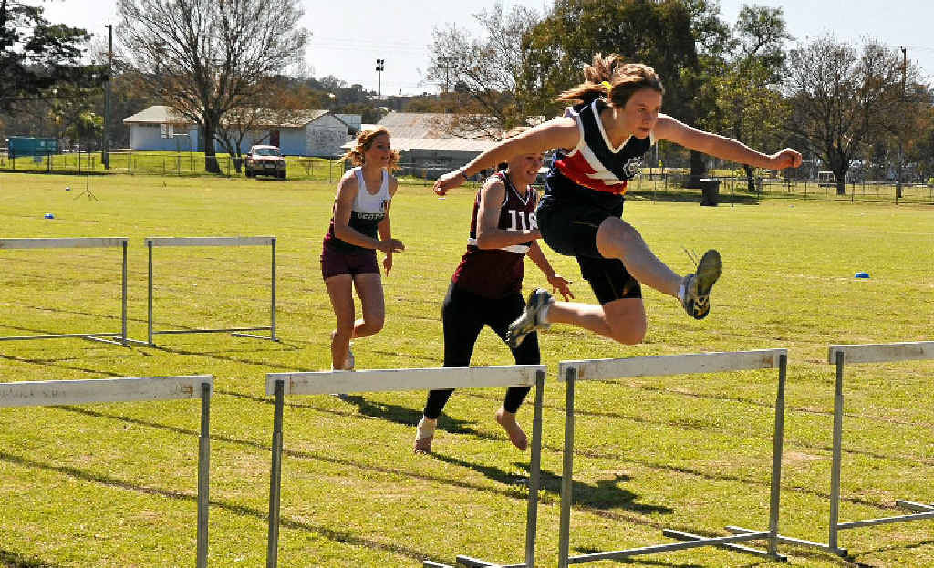 Melanie Hagenbach wins the 16 years girls hurdles at yesterday’s inter-school sports day at Hamilton Oval. Melanie Hagenbach wins the 16 years girls hurdles at yesterday’s inter-school sports day at Hamilton Oval.